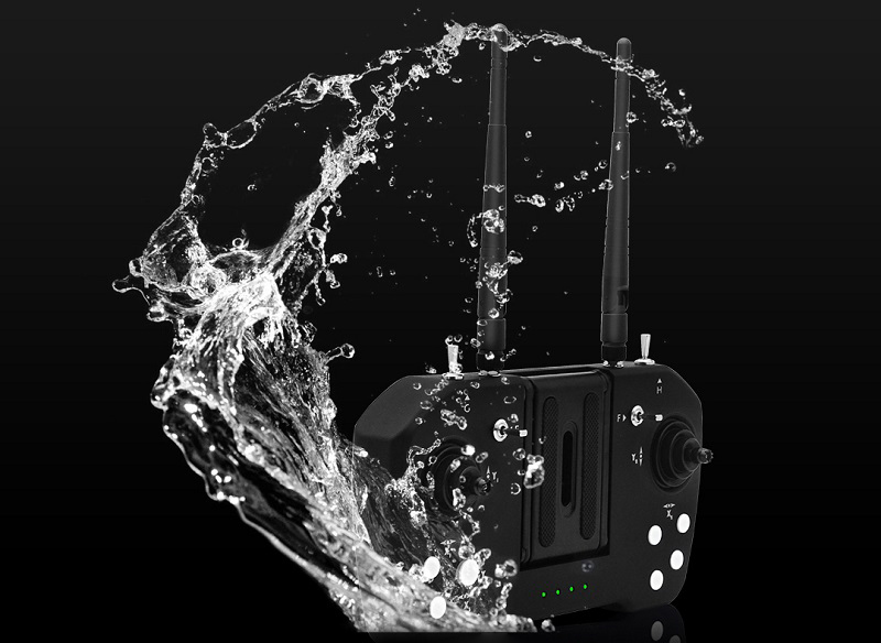 Skydroid T12 remote controller splashed with water, showing its sealed field-ready design